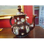 A Victorian Bargeware teapot with inscribed plaque,