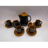 A Prinknash coffee set comprising of coffee pot, four cups and saucers,