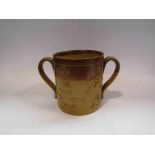 A 19th Century twin handled two tone tankard, chipped,