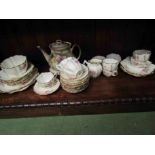 A Melba white ground tea set with pink floral design and a Crownford floral design teapot on stand