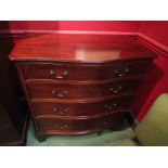 A George III revival mahogany serpentine front chest of four long drawers on bracket feet,