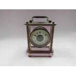 An early 20th Century carriage clock with pink tint glass