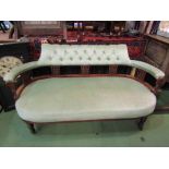 A late 19th Century mahogany salon sofa with mint green button upholstery,