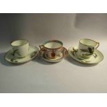 Two Victorian George Jones butterfly cups and saucers and a Minton cup and saucer