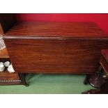 A George III mahogany drop-leaf table on brass castors,