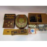 A box of miscellaneous games including chess set, cribbage boards,