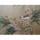 A framed and glazed painting on silk depicting a bird on bamboo, unsigned,