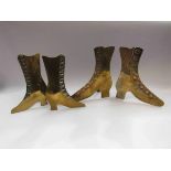 Two pairs of brass ornamental mantelpiece boots