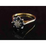 An 18ct gold sapphire and diamond daisy ring. Size P, 2.