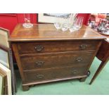 A walnut three drawer chest on bracket feet,