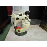 A cast iron doorstop "Cow jumped over the moon" 22cm tall