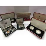 A collection of cased silver proof coins from mainly African countries,