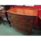 A Victorian bow fronted mahogany chest of three drawers on bun feet,