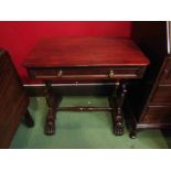 A William IV mahogany table the round cornered top over a single frieze drawer on shaped end base