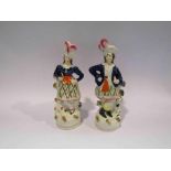 A pair of Victorian Staffordshire highland figures,