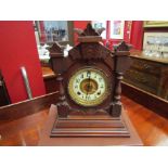 An American Ansonia 8 day striking mantel clock in mahogany case (with key)