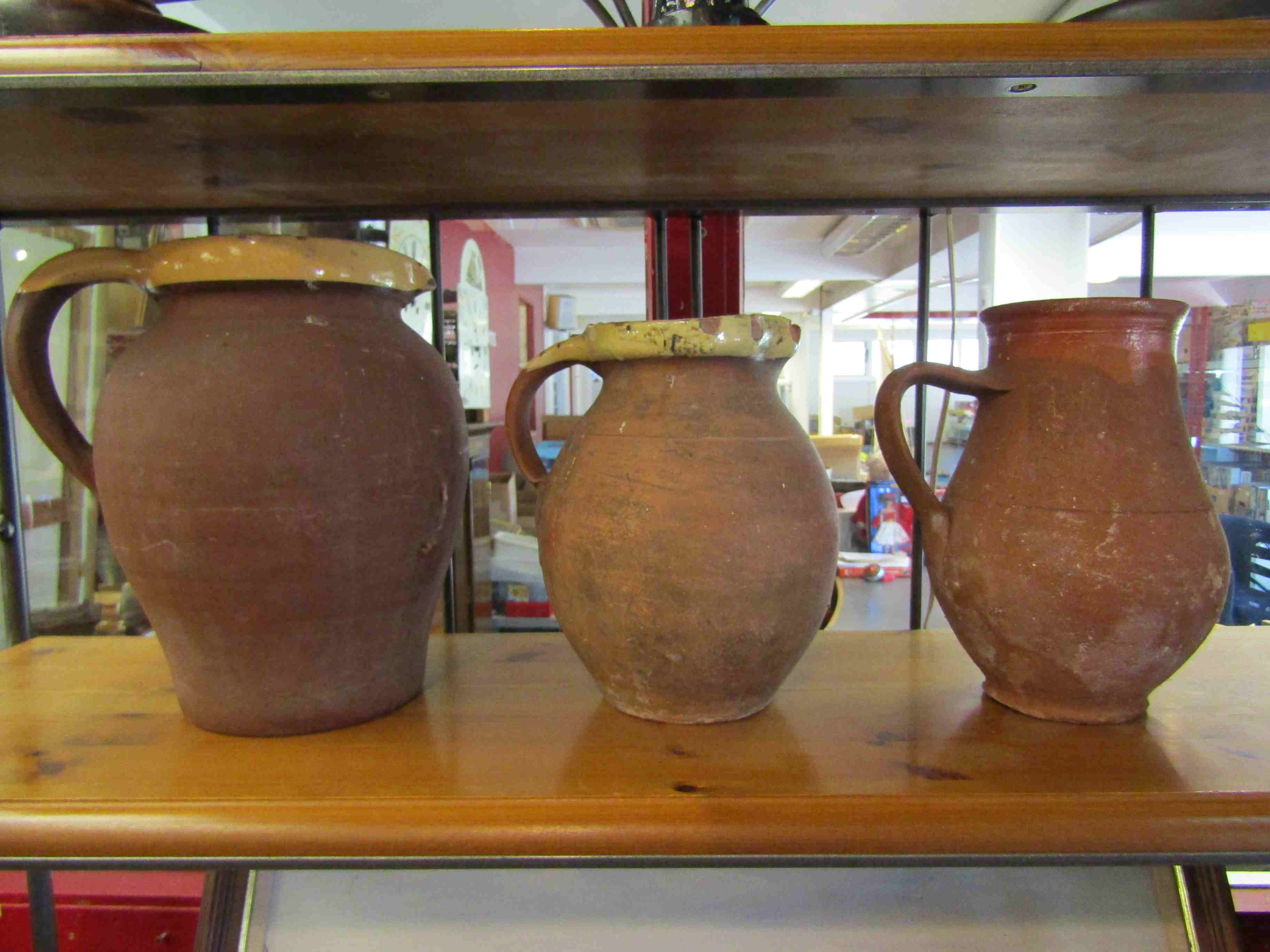 Three large terracotta jugs