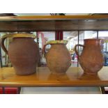 Three large terracotta jugs