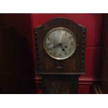 A 1920's oak grandmother clock,