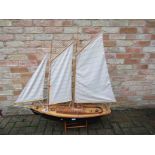 A wooden model schooner, approx.