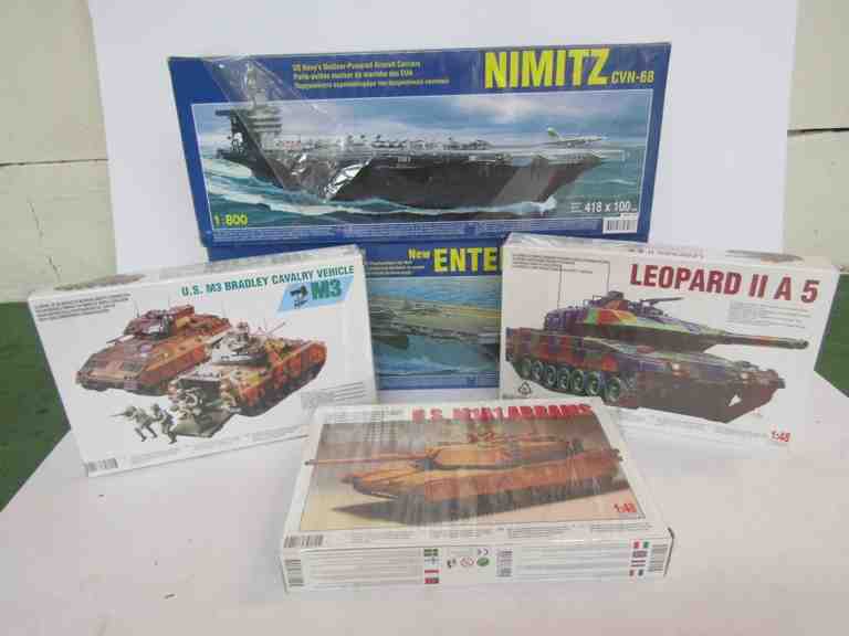 Three 1:48 scale plastic model tank kits and two 1:800 scale aircraft and carrier plastic model