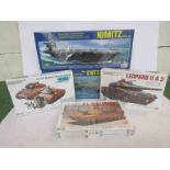 Three 1:48 scale plastic model tank kits and two 1:800 scale aircraft and carrier plastic model