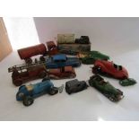 A collection of mixed tinplate and plastic clockwork vehicles for restoration including CKO