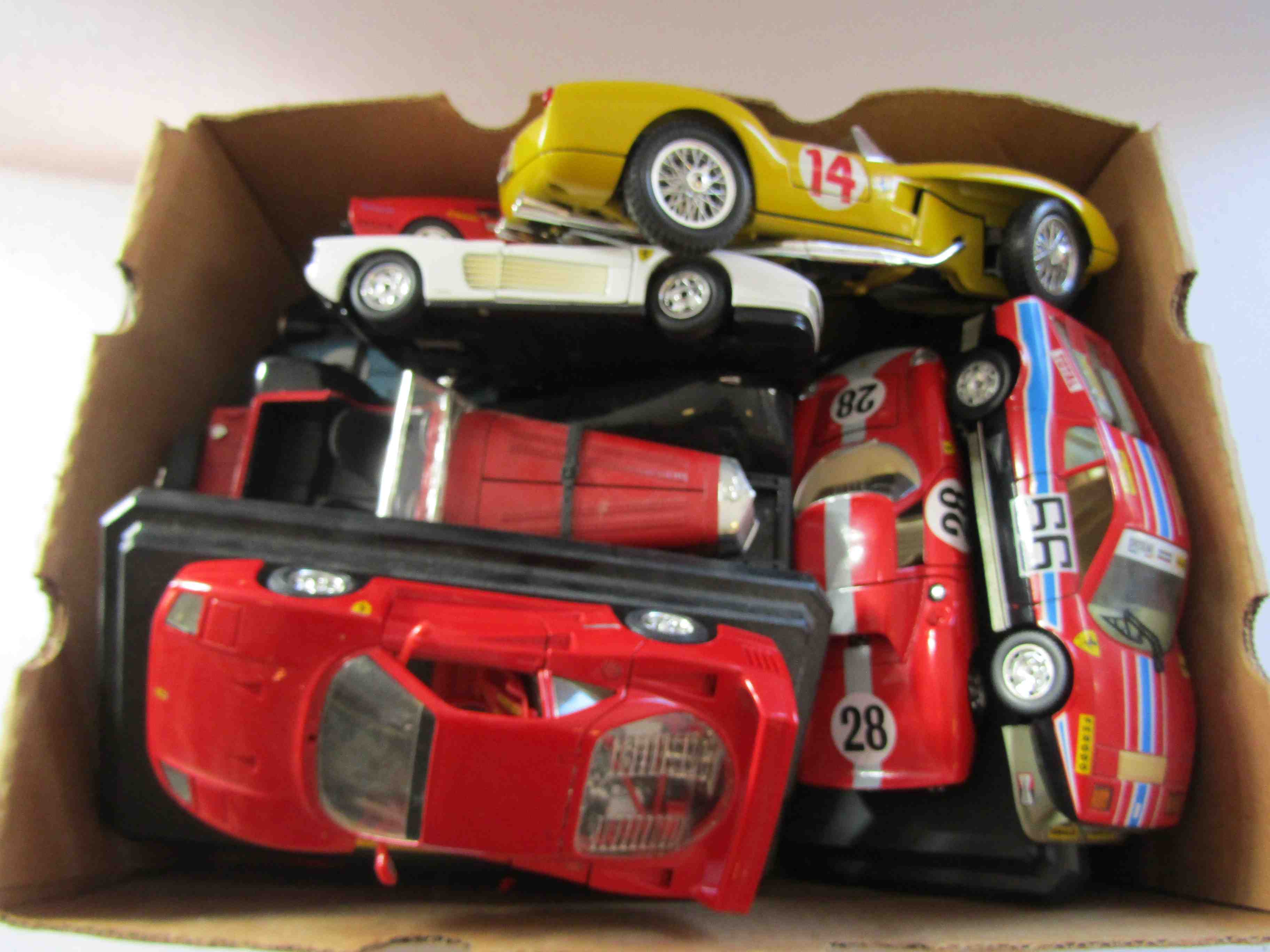 A collection of Burago 1:18 and 1:24 scale diecast cars and a Polistil 1:16 scale diecast car (11)