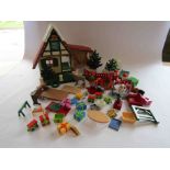 A Playmobil Christmas house with figures and accessorries