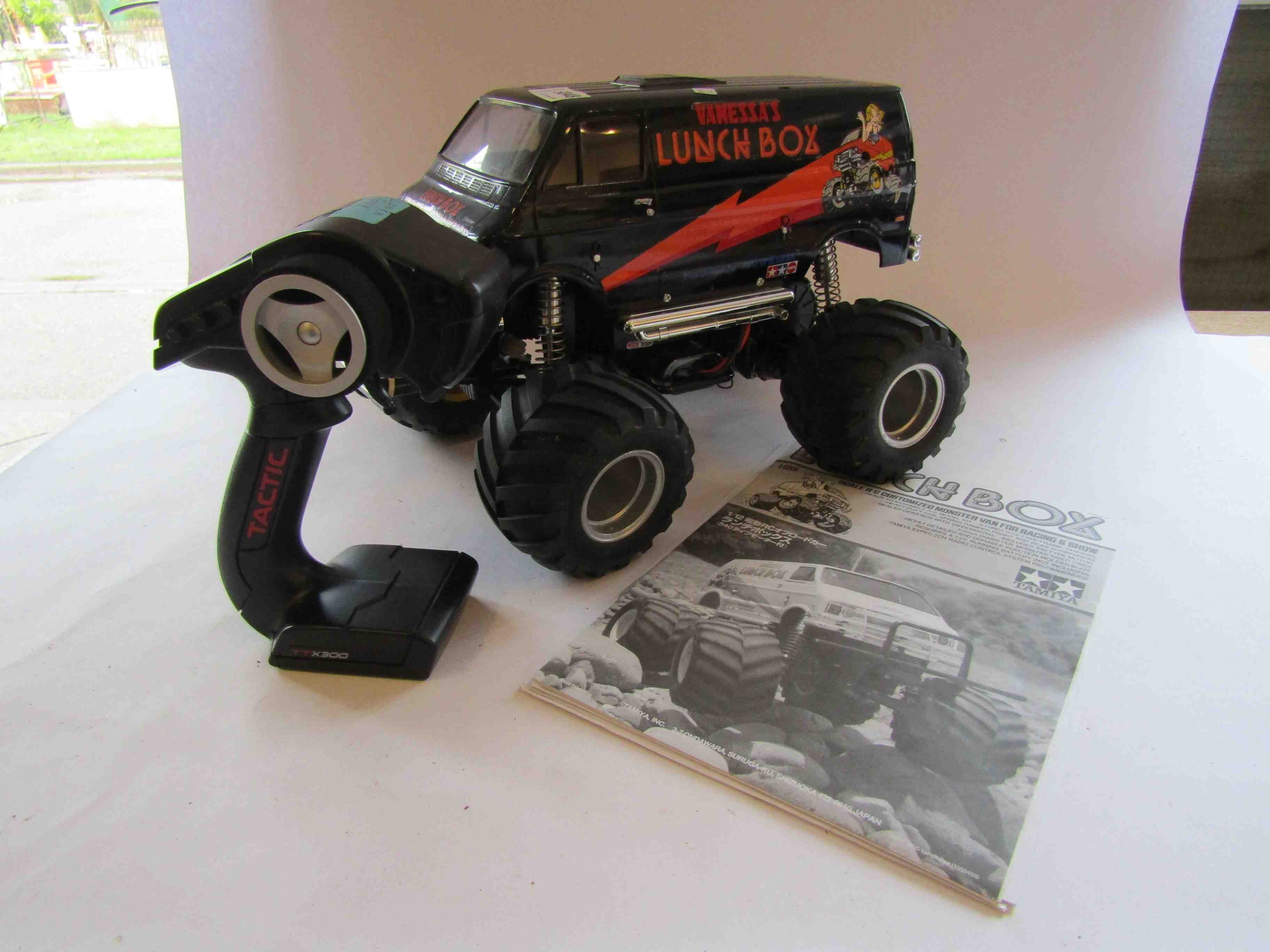 A Tamiya kit built 1:12 scale radio controlled Lunch Box Customized Monster Van with Tactic remote