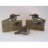Two boxed Britains artillery guns and one loose example