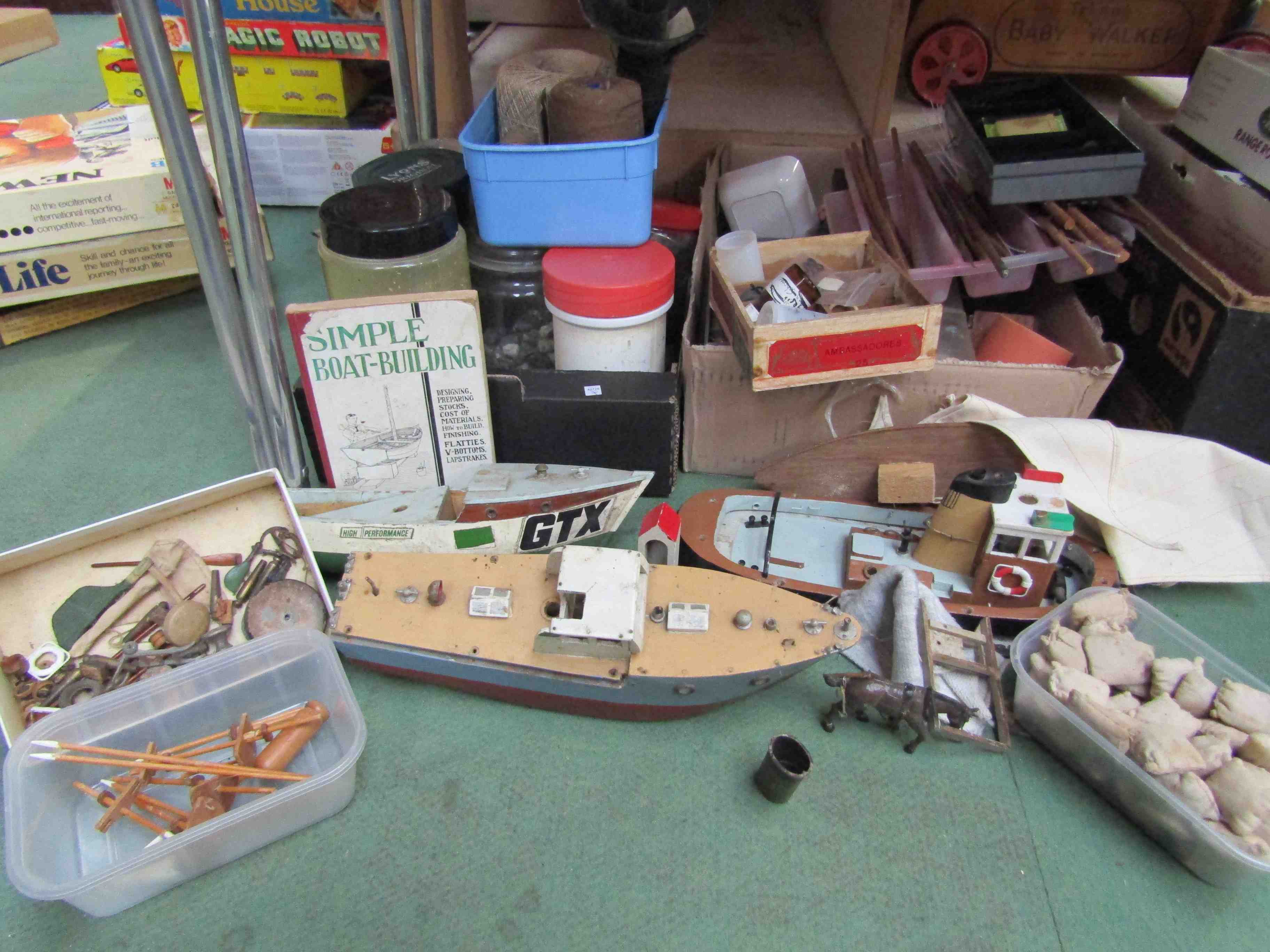 Three wooden model boats and a quantity of boat building materials and accessorries, cargo,