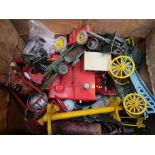 A collection of playworn diecast vehicles including military and agricultural examples