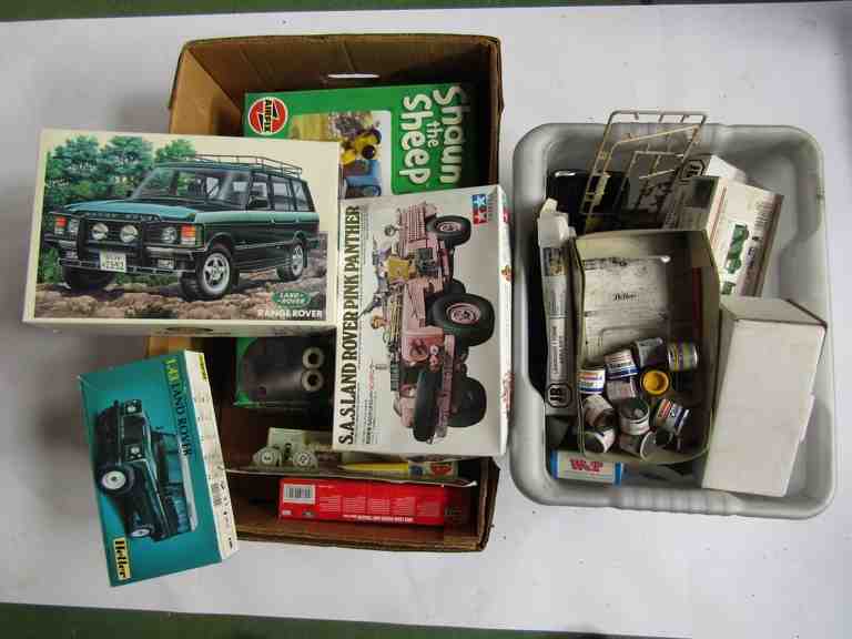 Assorted Land Rover model kits and part kits and a box of model paints and accessories