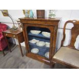 A 19th Century mahogany and walnut pier cabinet with glazed door, some brass beading missing,