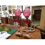 A pair of Arts and Crafts oil lamps with shades and Hicks burners,