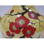 An Arcadian Stoke-on-Trent twin handled vase with lustre glaze, handpainted floral detail,