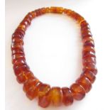 A chunky amber necklace with screw clasp, 46cm long,