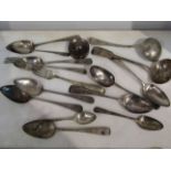 A collection of silver cutlery including Georgian sauce ladle,