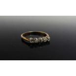 A five stone diamond ring, stamped 18ct Plat. Size R, 2.