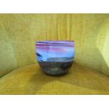 ANTHONY STERN (b.1944): A Studio glass bowl with "moonscape" and bands of blue, pink and amethyst.