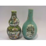 Two early 20th Century Oriental vases, one of gourd form, 19cm and 17.