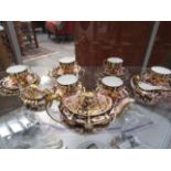 A composite Royal Crown Derby pattern 2451 Imari tea set consisting of six tea cups, six saucers,