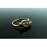 An 18ct gold five stone diamond crossover ring. Size N, 3.