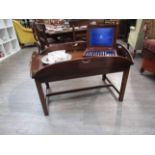 A mahogany butler's table with drop down sides,