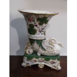 A Victorian porcelain trumpet vase with swan form relief, scrolled supports,