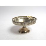 A Mappin & Webb silver pedestal dish with pierced border, Sheffield 1923, slight dents,
