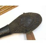 Polynesian tribal art including axe, paddle,