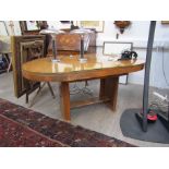 A Deco dining table with oblong wood and glass top,