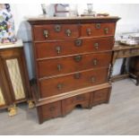 An early 18th Century oak chest on stand with brass drop handles,